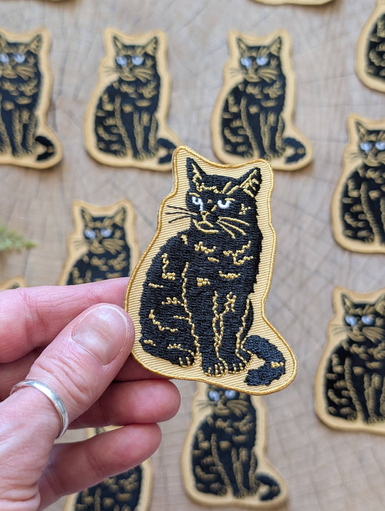 Iron-on patch | sitting black disappointed cat 2.9" x 2.2"