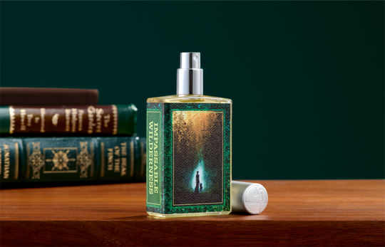 A rectangular glass perfume bottle labeled &