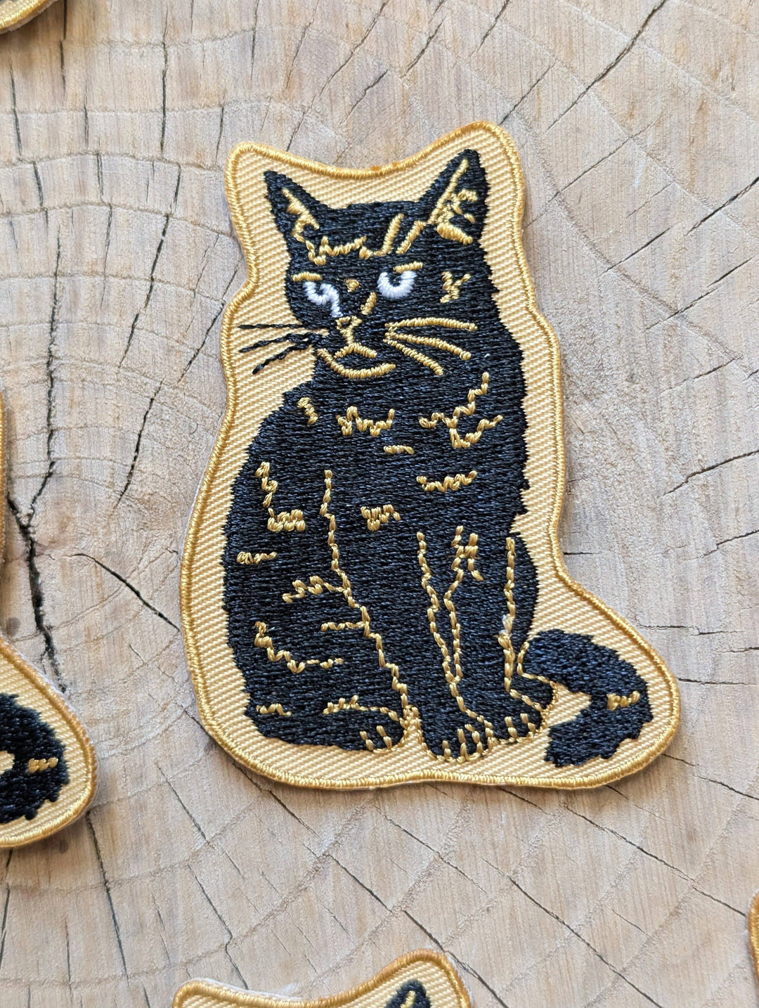 Iron-on patch | sitting black disappointed cat 2.9" x 2.2"