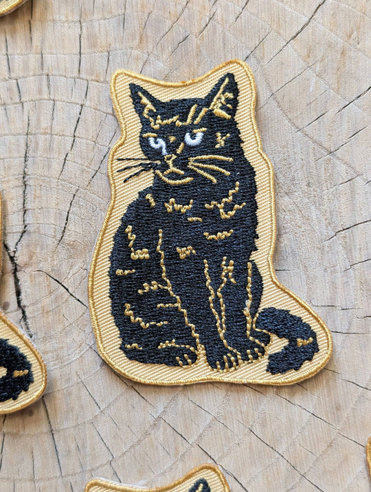 Iron-on patch | sitting black disappointed cat 2.9" x 2.2"