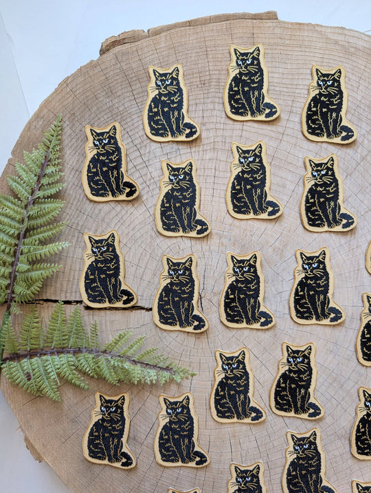 Iron-on patch | sitting black disappointed cat 2.9" x 2.2"