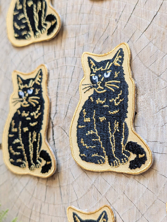 Iron-on patch | sitting black disappointed cat 2.9" x 2.2"